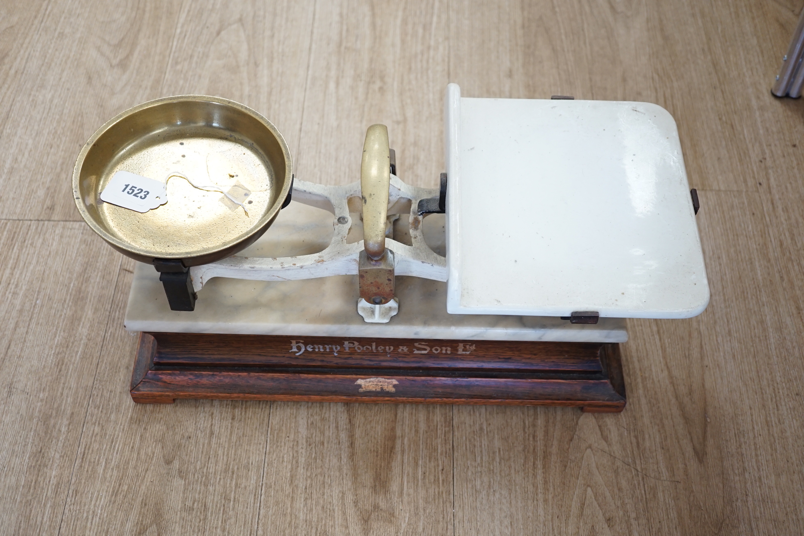 A pair of marble and brass shop counter scales, 53cm wide